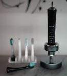 Panasonic's EW-DP52-K electric toothbrush utilizes both bristles and sonic vibrations for teeth cleaning. The included brush heads, cleaning modes, and detailed instruction manual, combined with a somewhat difficult-to-navigate mode selection, create a bit of confusion, but there's no doubt that your mouth will be clean!