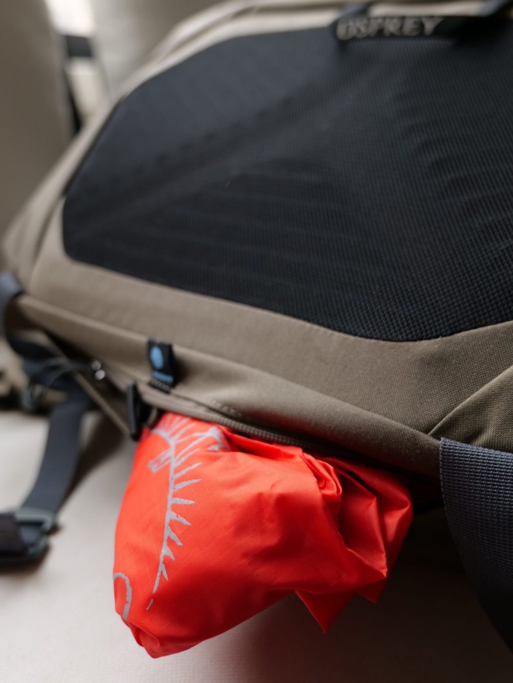 The rain cover is pulled out from the bottom.