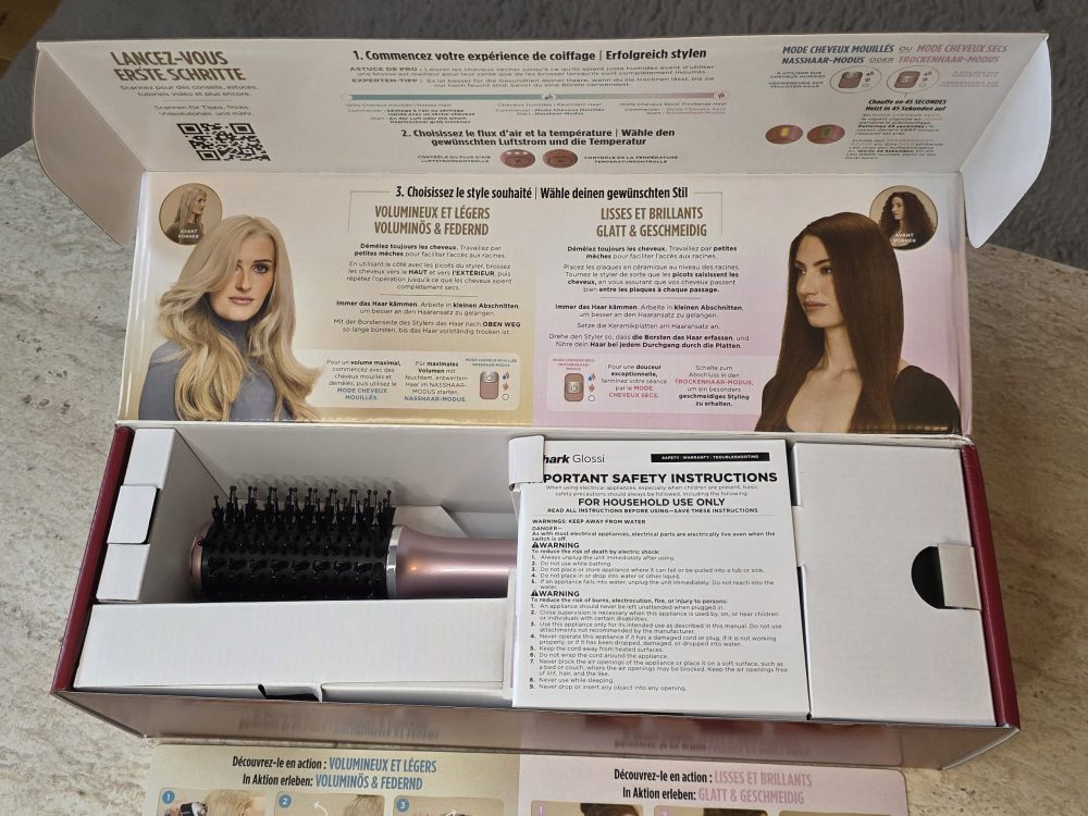 Shark Glossi in its box with instructions.