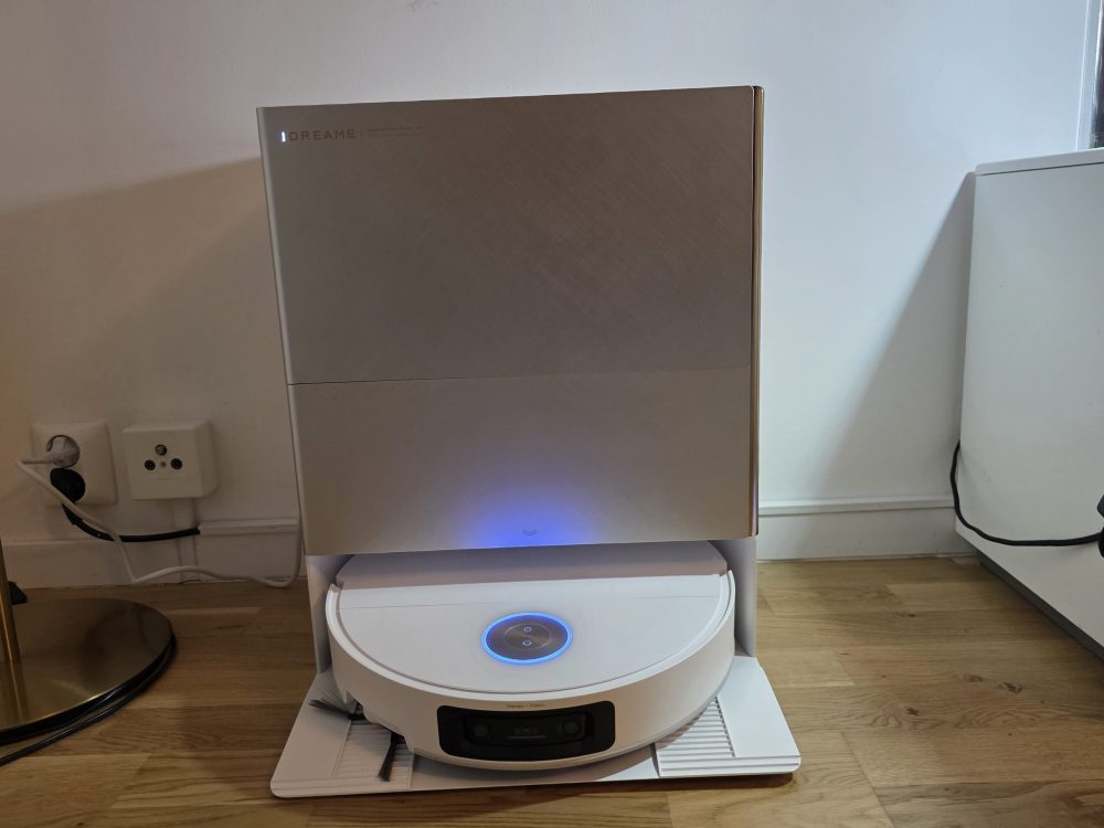 Dreame X60 Ultra robot vacuum cleaner in its base station.