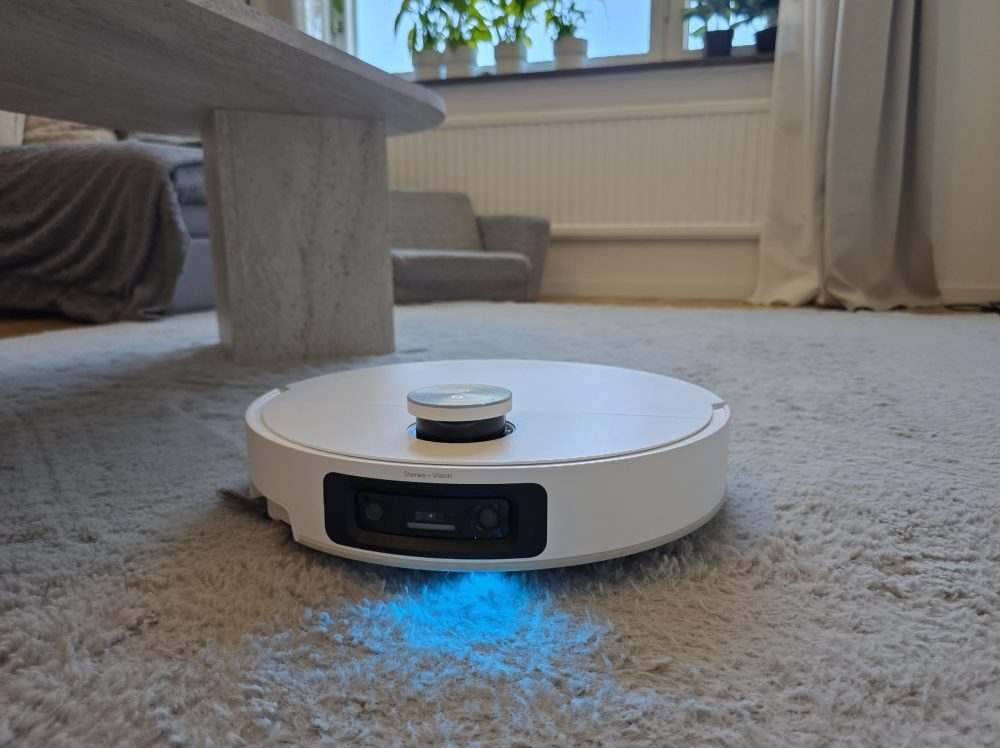 Dreame X60 Ultra robot vacuum cleaner vacuuming in a living room